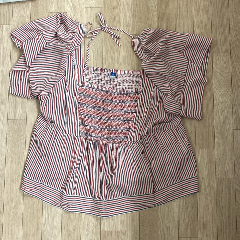 Red white and blue blouse.